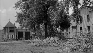 Large maple tree was snapped-off it's trunk during the 1911 storm on the SE corner of Grant and Liberty streets. The Nation House, a hotel, stood where Gant Realty stands today and the old trolley car barn across the street is where the Dollar Store and it's parking lot are today. Notice Grant street was still a dirt road.