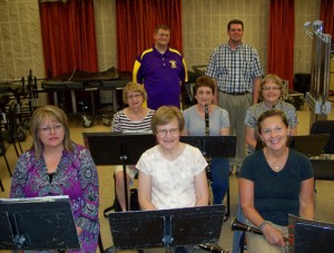 Assistant director Tim Wolf, back left, with director Randy Claes, standing behind part of the Community Bands clarinet section.