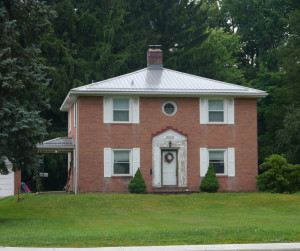 The house at 2006 Cleveland Rd. as it looks in 2014. The distinctive roof-line is gone and a porch has been added to the side of the house. Sometimes an architect's original design does not hold up to actual living conditions and residents make necessary changes. 